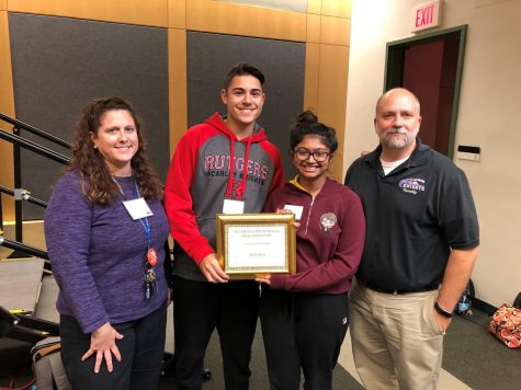 Old Bridge accepts its yearbook award.